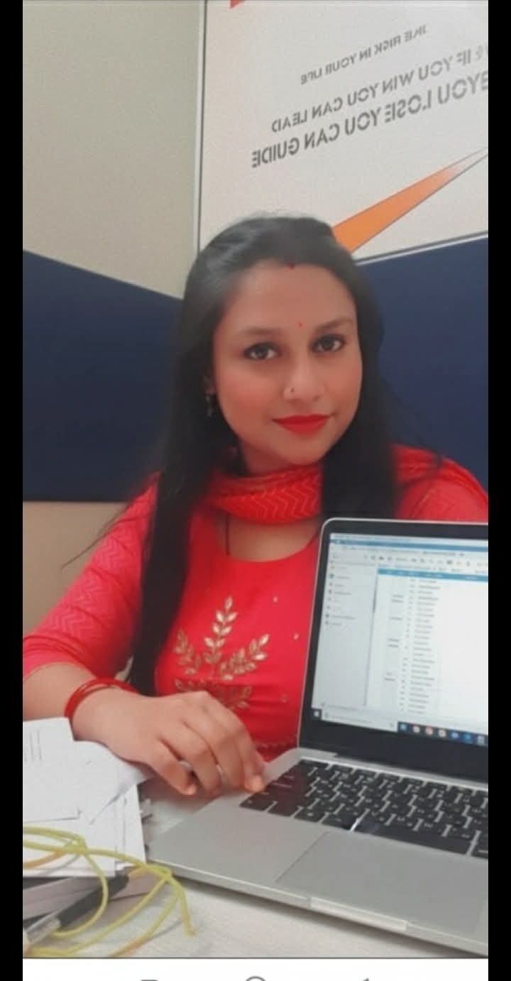 Professional woman sitting at tablewith an laptop